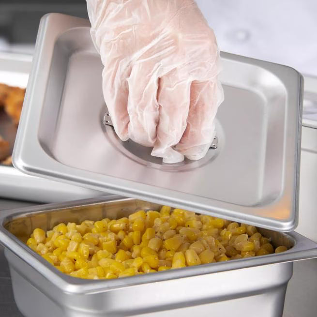 Protect food with the DuraPan Stainless Steel Steam Table Hotel Pan Handled Cover 1/6 Size 607160C. Features heavy gauge stainless steel construction and a comfortable concave handle.