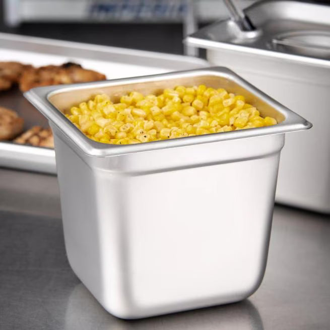 Prepare and serve food efficiently with the DuraPan Light Gauge Stainless Steel Steam Table Hotel Pan 1/6 Size 6 Inch Deep 607166. Features spoonable bottoms, freezer-to-oven versatility, and Coldmaster compatibility.