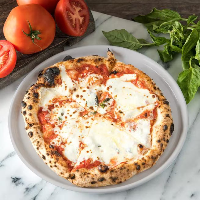 10.5 Inch Greige Stadia Melamine Dinner Plate with commercial grade break resistant construction and a modern organic shape. Perfect for serving steaks, seafood, pasta, sandwiches and complete meals.