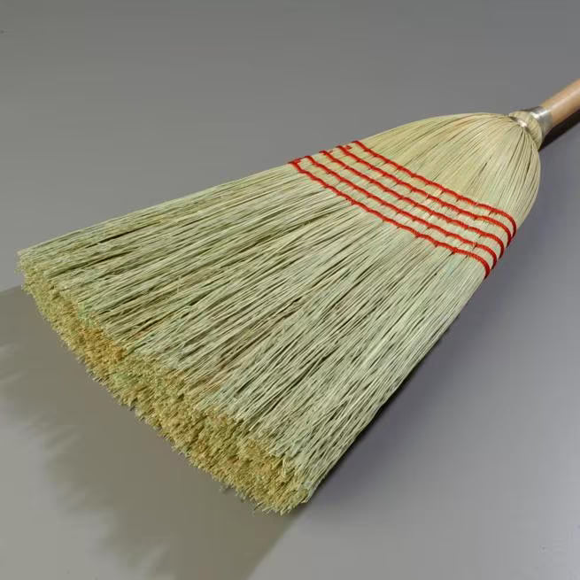 56 Inch Tan 5-Stitch Janitor Broom with 100% natural corn bristles, a heavy duty lacquered wood handle and a high bristle fill count for durable commercial sweeping performance.