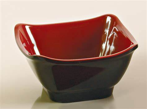 Yanco Square Bowl CR-5450 is a great and affordable restaurant tableware. It is made from durable and reliable melamine material, which makes the bowl look like ceramics. You can use these unique square bowls to serve such Asian dishes like rice, miso soup, noodles or salads. Thanks to the stylish Black&amp;Red collection style, the bowl will perfectly fit any food-serving establishment design. Melamine tableware is an ideal solution for those who choose high-quality,
