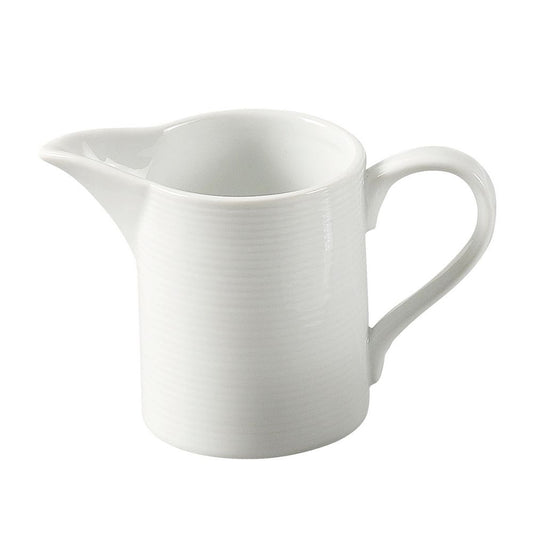Yanco Creamer PA-PC is a refined addition to any restaurant, café, or hotel beverage service. Designed for serving cream, half &amp; half, or milk alongside coffee and tea, this creamer features a well-defined spout and a petite handle for easy pouring. Crafted from durable porcelain, it withstands heavy daily use while maintaining an elegant, super white finish that enhances table presentation. 