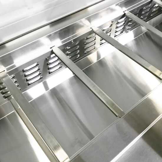 Coldline SP27 27-inch refrigerated sandwich prep table with a cutting board and food pans. Ideal for foodservice, it features a spacious top for easy prep and storage, enhancing efficiency in sandwich preparation.