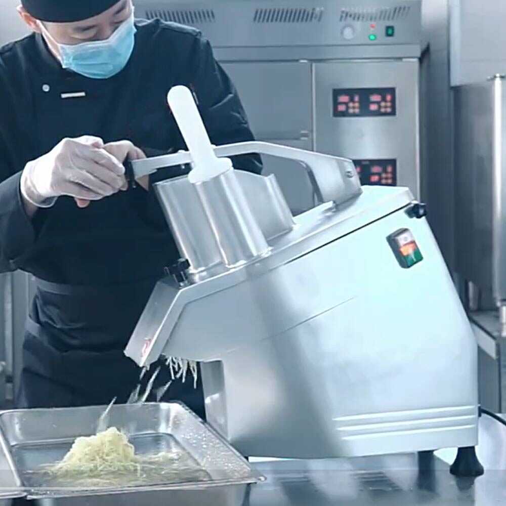 Prepline vegetable cutter, a continuous feed food processor with five interchangeable disks, designed for efficient slicing, dicing, and shredding in commercial kitchens.