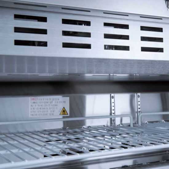 Coldline SP27 27-inch refrigerated sandwich prep table with a cutting board and food pans. Ideal for foodservice, it features a spacious top for easy prep and storage, enhancing efficiency in sandwich preparation.