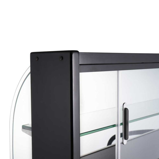 The Marchia USTAR-T25 26" dry curved glass bakery display case features a sleek, non-refrigerated design with a spacious interior for showcasing baked goods, a curved glass front for optimal visibility, and elegant black trim.